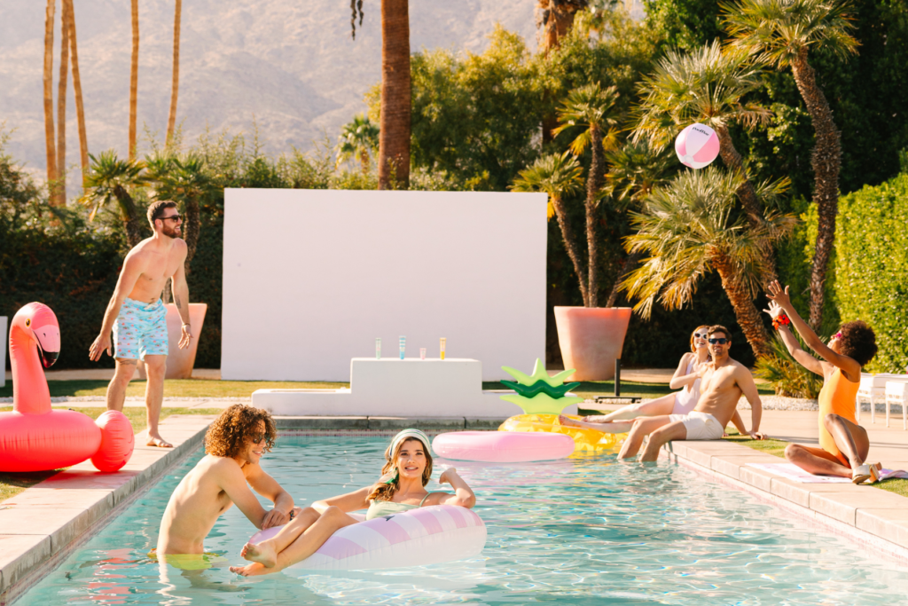 Group of people playing around a pool