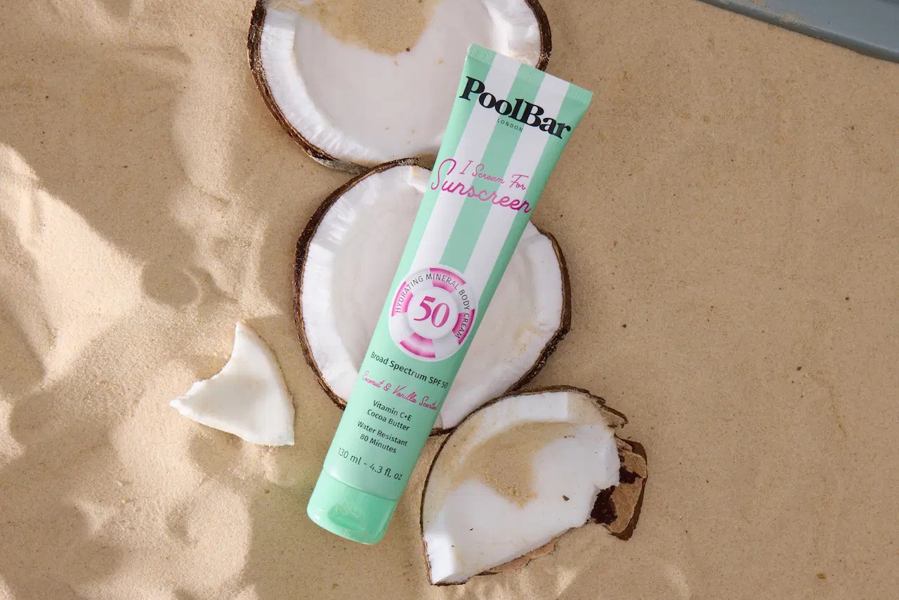 spf 50 sunscreen in coconut and sand layout